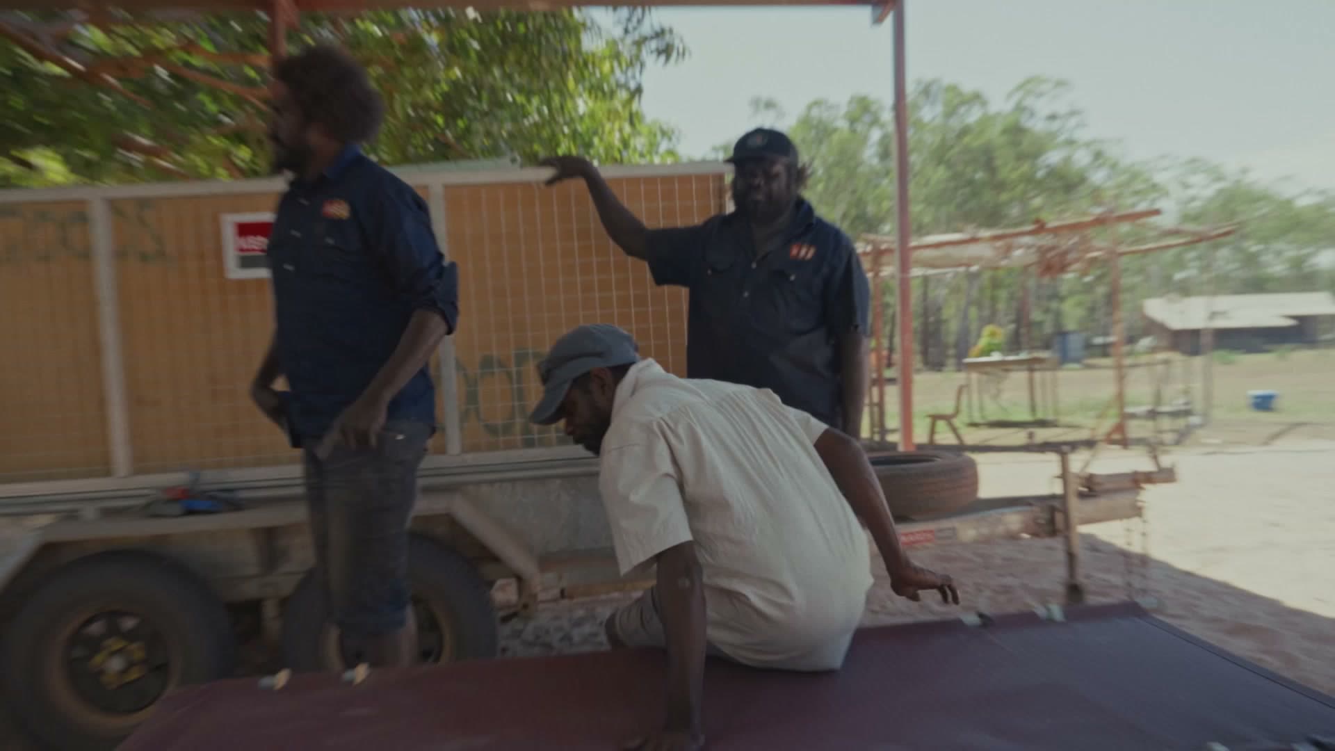 Maningrida, July 2026 — Build day, community assembling the beds.